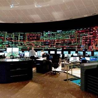 Engineers monitoring grid control screens